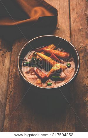 Indian Baby Corn Masala or spicy Baby corn curry served with roti or naan or indian bread