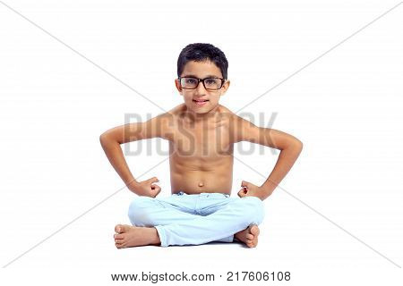 young happy indian boy showing his muscle