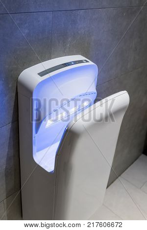 Modern Vertical Hand Dryer In Public Restroom