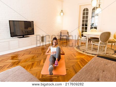 Fit Young Woman Exsercise In The Room