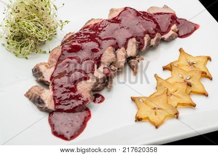 Veal, Beef in cherry sauce. on the plate