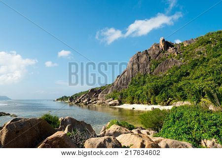 tropical landscape of a natural bay with rock hill Anse Pierrot La Digue Seychelles