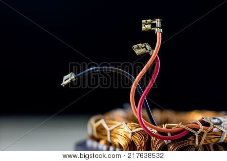 Parts For An Electric Motor On A Wooden Table. Stator Of The Engine On A Wooden Workshop Table.