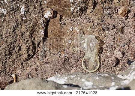 Used Condom On Ground contraceptive sheath detail