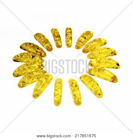 frame of amber stones similar to sun rays in perspective isolated on white background with place for your text