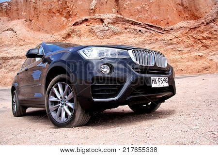 Antofagasta Chile - November 15 2015: Modern black crossover BMW X4 xDrive 2.8i (F26) in the Valle de la Muerte (Mars Valley) in the Atacama Desert.
