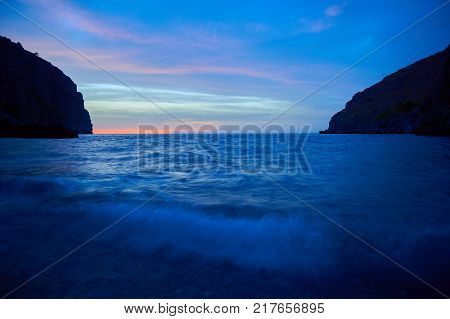 Calm blue twilight after sunset with sea wave