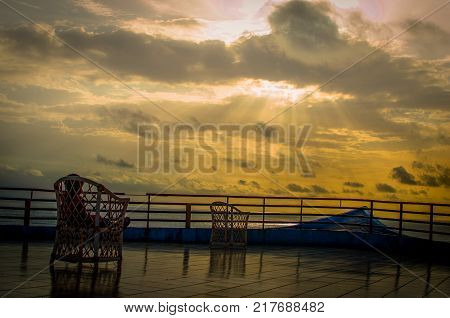 Sunset from Hilltop chairs and a balcony