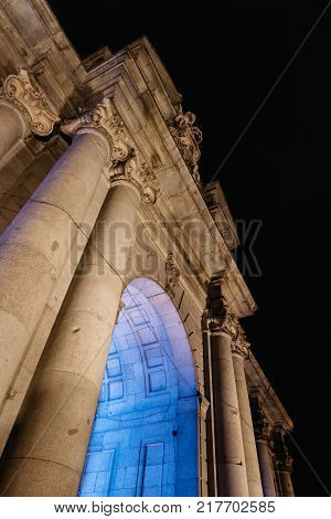 Madrid, Spain - December 8, 2017: Puerta de Alcala in Madrid at night on Christmas time. Low angle view
