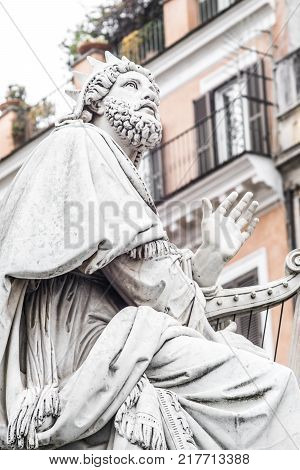 King David Statue , detail of the base of the Column monument to the Immaculate Conception, by Adamo Tadolini in 1856 located in Piazza di Spagna in Rome. italy