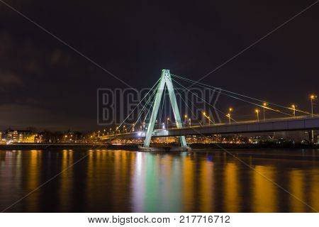 Close-up of the beautiful Deutzer Bridge, the long River Rhine and the City of Cologne at Night in Germany Cologne 2017