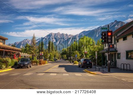 CANMORE, ALBERTA, CANADA - JUNE 26, 2017 : On the streets of Canmore in canadian Rocky Mountains. Canmore is located in the Bow Valley near Banff National Park and is a popular tourist destination.