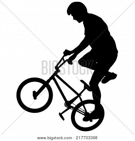 Silhouette of a cyclist male performing acrobatic pirouettes. vector illustration.