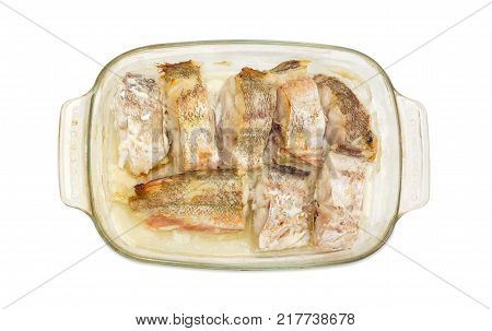 Top view of the rectangular glass casserole pan with several baked pieces of the red cod on a white backgroundr