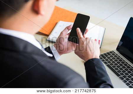 Using Smartphone By Businessman At Pool