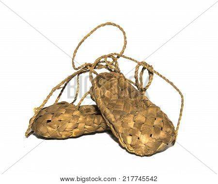 woven birch sandals for everyday wear in the village on a wooden background