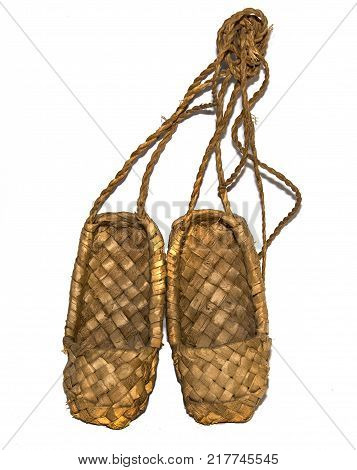 woven birch sandals for everyday wear in the village on a wooden background