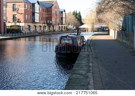 A canal barge moored up on the Leeds Liverpool canal in Wigan