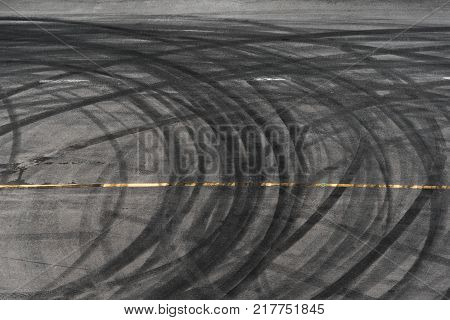 abstract of Black tire wheels caused by Drift car on the road