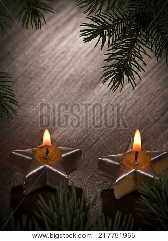 Two Christmas Candles with Twig on the Desk