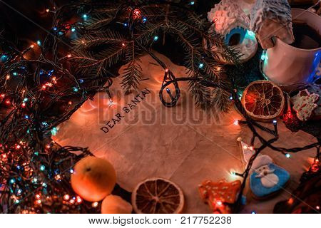Letter for Santa on decorated chrismas background with gingerbread coocies and garland