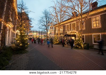 GOTHENBURG - NOVEMBER 16, 2013: People stroll at Liseberg on November 16, 2013 in Gothenburg. The Christmas market at Liseberg is an annual tradition.