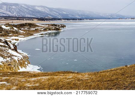 View above big beautiful lake and mountain in winter, Baikal lake, Russia, Siberia