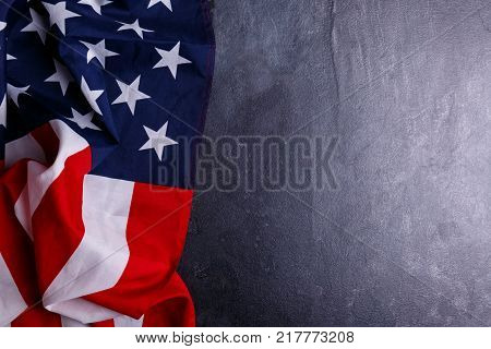 American flag US symbol lies horizontally on the left on a gray background