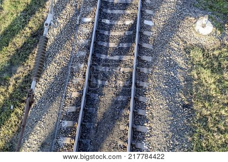 Plot railway. Top view on the rails. High-voltage power lines for electric trains.