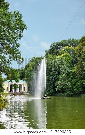 Beautiful landscape Fountain Snake and Flora Pavilion on background in the National Arboretum Sofiyivka Uman Ukraine