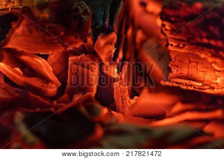 Burnig charcoals and remaining ashes with ember