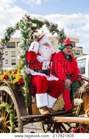 CAGLIARI, ITALY - DECEMBER 8, 2017: Village and parade of Santa Claus, Viale Bonaria - (Santa Claus in carriage) Sardinia