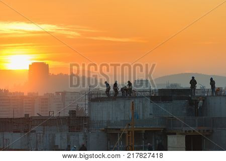 Santiago Las Condes district Chile - August 08 2017: Workers on a real estate development in Las Condes district one of the wealthiest and booming areas for construction of the city.