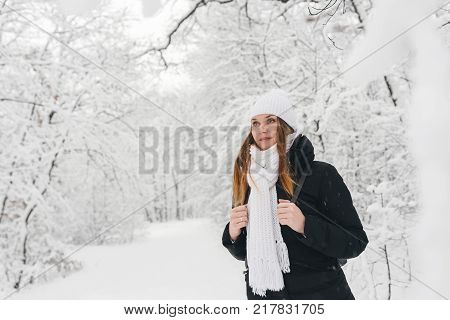Beautiful Young Girl In A White Winter Forest