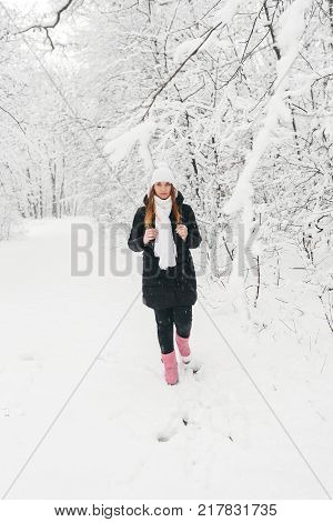 Beautiful Young Girl In A White Winter Forest