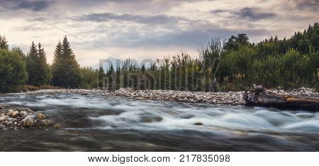 Bela River with Krivan Peak in Background at Sunset in Slovakia