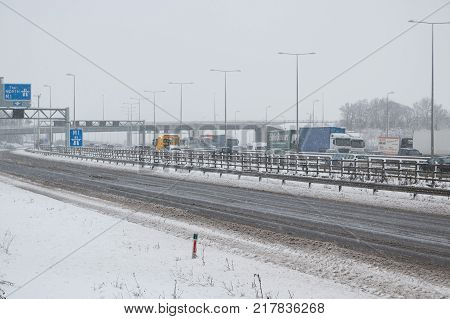Hemel Hempstead UK - December 10 2017:Traffic on the British motorway M1 during the snowstorm