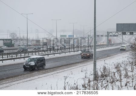 Hemel Hempstead UK - December 10 2017:Traffic on the British motorway M1 during the snowstorm