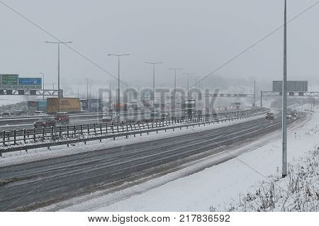 Hemel Hempstead UK - December 10 2017:Traffic on the British motorway M1 during the snowstorm