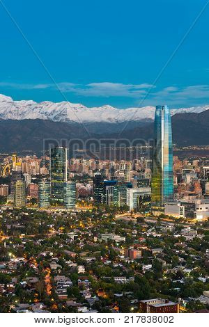 Skyline of Santiago de Chile at the foots of The Andes Mountain Range and buildings at Providencia district.