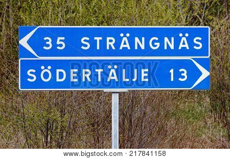 Swedish signpost for the two cities Strangnas and Sodertalje.