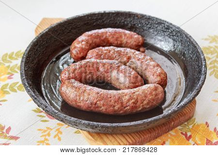 delicious homemade sausages fried in the pan