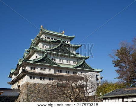 The main tower (Tenshu) of Nagoya Castle over blue sky