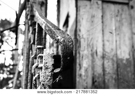 rust on a lost building in black and white