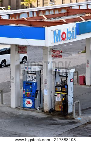 NEW YORK CITY USA - AUG. 26: Mobil gas station with gas prices in Manhattan on August 26 2017 in New York City NY. Mobil is a major American oil company.