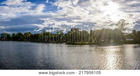 landscape photo of Naung Yar Lake with cloudy and sunshine background, Loikaw, Kayah State, Myanmar, Oct-2017