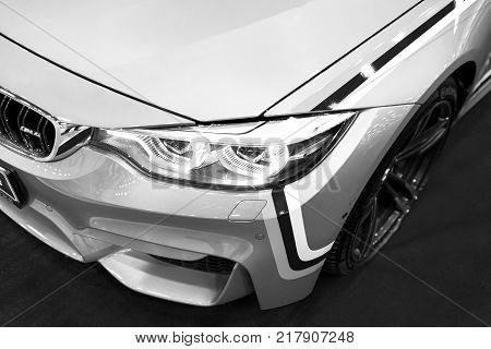 Sankt-Petersburg Russia July 21 2017: Front view of a BMW M4 sports car. M Performance Edition. Car exterior details. Black and white. Photo Taken at Royal Auto Show July 21