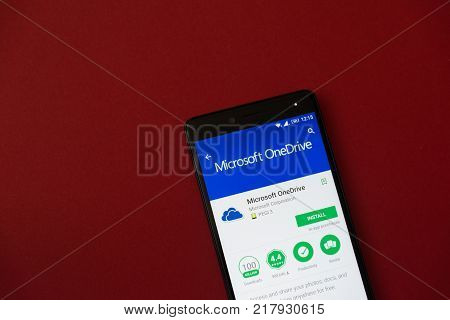 Los Angeles, december 11, 2017: Smartphone with Microsoft OneDrive application in google play store on red background