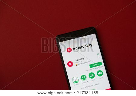 Los Angeles, december 11, 2017: Smartphone with Musical.ly application in google play store on red background