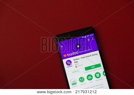 Los Angeles, december 11, 2017: Smartphone with Badoo application in google play store on red background